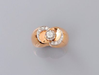 null Yellow gold ring, 750 MM, centered with a diamond between two arches underlined...