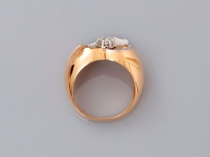 null Yellow gold ring, 750 MM, centered with a diamond between two arches underlined...