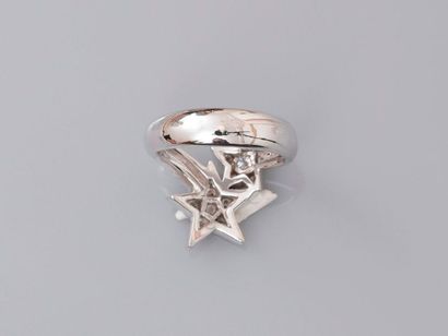 null Ring drawing two white gold stars, 750 MM, covered with diamonds, weight: 7.2gr....