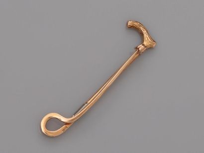 null Brooch barrette brooch drawing a cane and its pommel in gold, 585 MM, length...