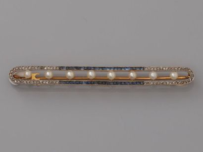 null Barrette brooch in yellow gold, 750 MM, highlighted by eight small untested...