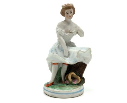null BISCUIT polychrome. Young woman, in a gust of wind, holding her petticoat, second...