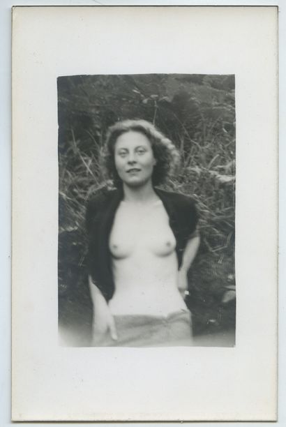 null AMATEUR PHOTOGRAPHER. Young blonde woman stripping in a clearing, late 1930s....