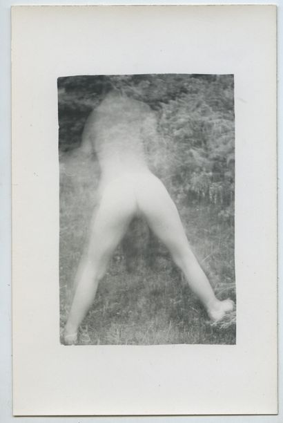 null AMATEUR PHOTOGRAPHER. Young blonde woman stripping in a clearing, late 1930s....