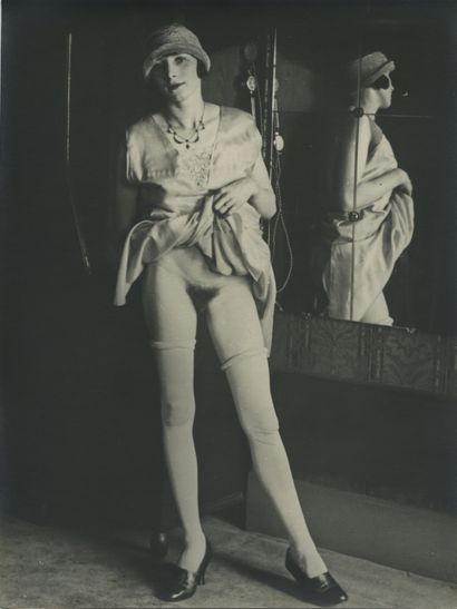 null Mr. X. Skirt up at the mirror, ca. 1930. Vintage silver print, 24 x 18 cm.