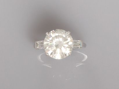 White gold solitaire ring, set with a brilliant-cut...