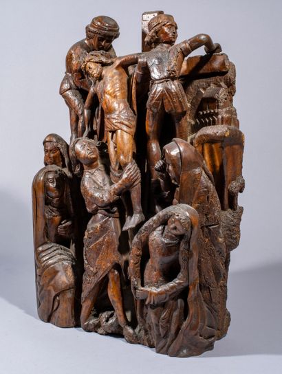 null Carved walnut altarpiece representing the Descent from the Cross

of the Cross.

Rheno-mosan...