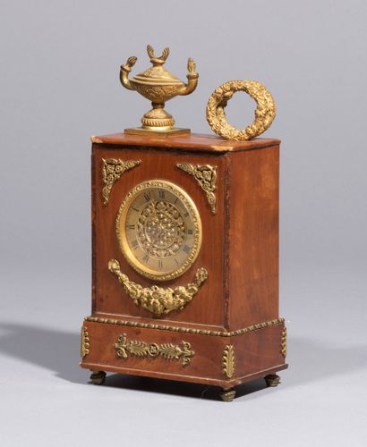 null 
Small mahogany officer's clock, with a flamed vase-navette and laurel wreath...