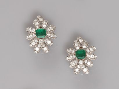  Gold flower ear clips, 750 MM, each with a square cut emerald weighing about 1 carat...
