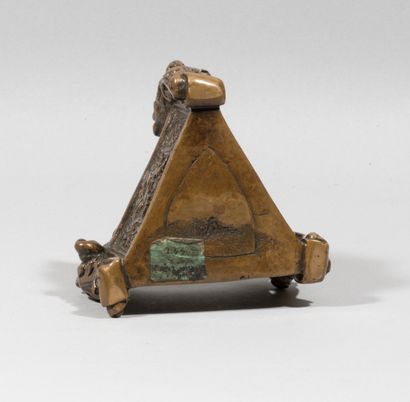 null Base of an oil lamp

bronze, brown patina

the three sides decorated with a...
