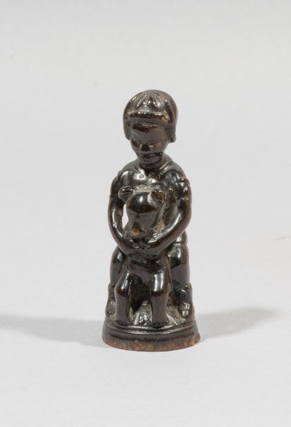 Chess pawn in blackened wood carved

in the...