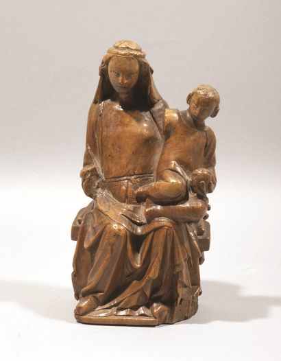 null Virgin and Child in boxwood carved in the round. Seated on a bench, Mary is...