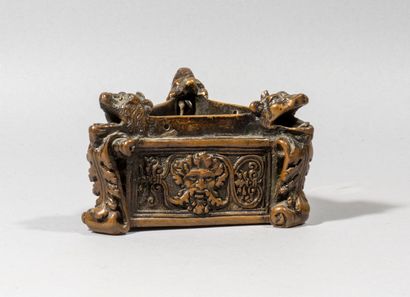 null Base of an oil lamp

bronze, brown patina

the three sides decorated with a...