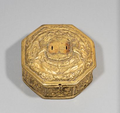 null Octagonal wedding box in embossed brass with floral decoration, the contour

symbolizing...