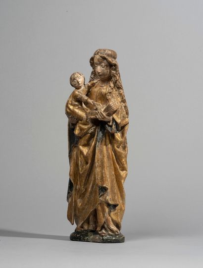 null Vierge à l’Enfant en noyer sculpté,

polychromé et doré ; marque du pal de

Malines...