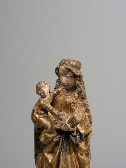 null Virgin and Child in carved walnut,

polychromed and gilded; mark of the

Malines...