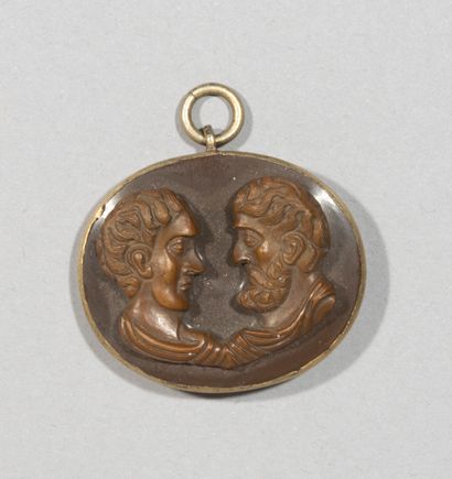 null Small pendant with decoration of the two ages of the man looking

in wood carved...