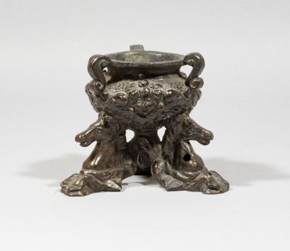 null Perfume burner

bronze, brown patina

of circular form, decorated with three...