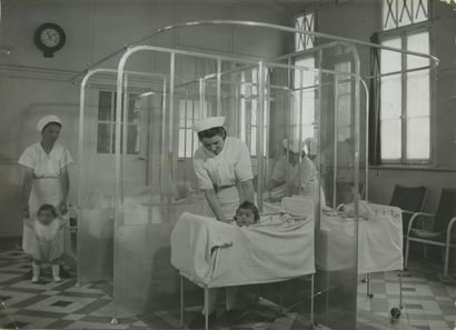 null Nurses in a Nursery, ca. 1950. Vintage silver print, 13 x 18 cm. Agency stamp...
