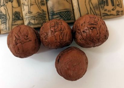 null CHINA. 4 carved nuts with erotic scenes. Joint: A bracelet consisting of 10...