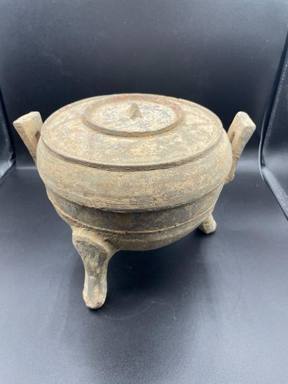 null Covered tripod ding urn. Grey terracotta. China. In the Han style. Restoration...