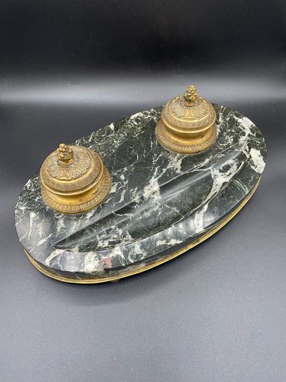null White-veined black marble inkwell with two gilded bronze cups, resting on four...