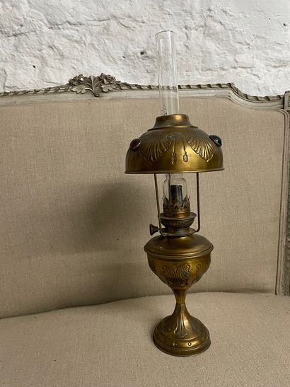 null Kerosene lamp in repoussé brass with stone inlays. Original tube intact.
