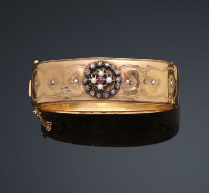 null Bracelet rigide, ouvrant en or jaune, 750 MM, orné de motifs ronds ornés de...