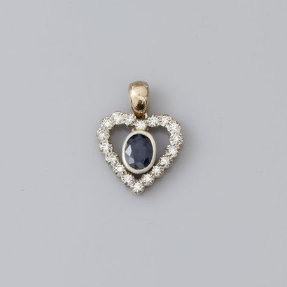 null Pendentif «cœur» deux ors, 750 MM, souligné de diamants et centré d'un saphir...