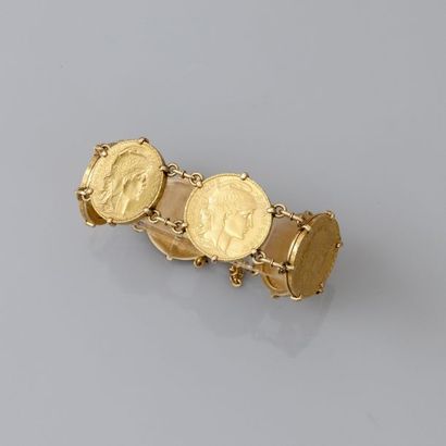 null Bracelet formé de sept pièces en or de 20 francs, 750 MM, dont une servant de...