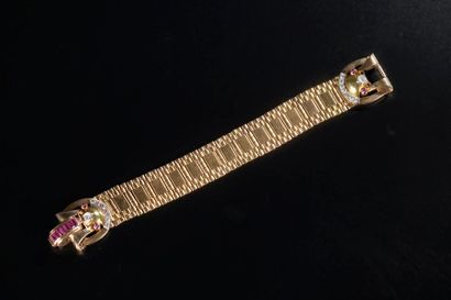 null Bracelet articulé en or jaune 750 millièmes, le fermoir à décor géométrique...