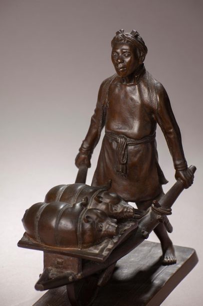 null Kinichiro ISHIKAWA (1871-1945).
Le boucher aux cochons.
Bronze à patine brune...