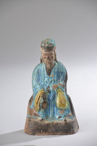 null CHINE - Époque Ming (1368-1644). 
Statuette en terre cuite partiellement émaillée...
