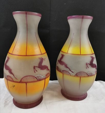 Deux vases en verre peint motif chevreuil,...