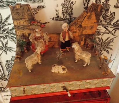 Automate boîte à musique avec deux personnages à tête de porcelaine et 3 moutons...