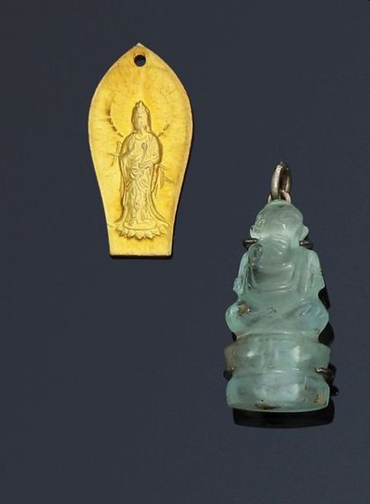 null Lot de 2 pendentifs: 

- Un petit Bouddha en cristal de roche, monture en argent....