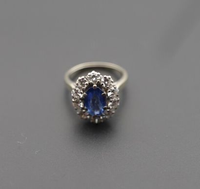 null Pompadour ring in 18K white gold, centered on an oval sapphire weighing approx....