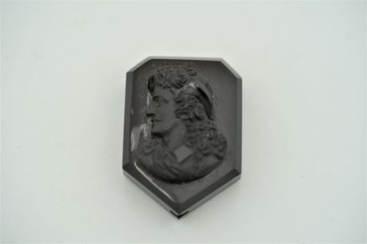 null A brown glass cameo in the form of an escutcheon showing on one side Molière...