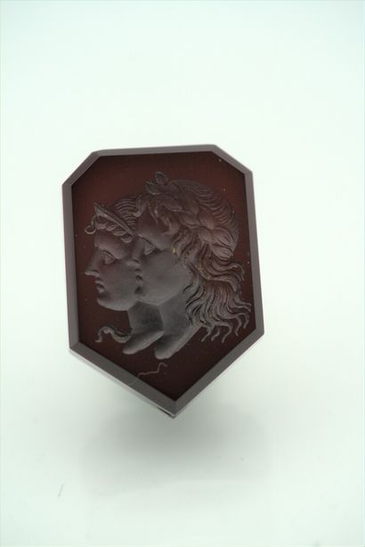 null A brown glass cameo in the form of an escutcheon showing on one side Molière...