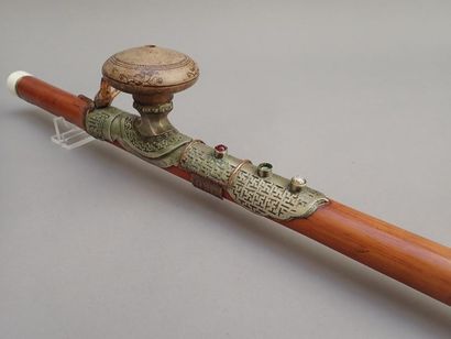 null Opium pipe made of stained bamboo, ivory tips (a rough and glued tip). Plate...