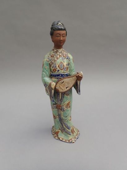 null CAI MAY (Saigon). Young woman with a guitar in traditional tunic and butterfly...