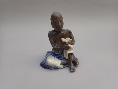 null BLEEP. Partially glazed stoneware subject depicting an old ascetic. Height:...