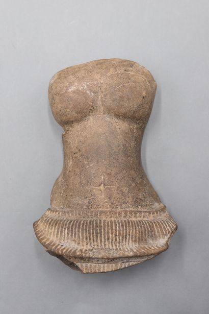 null Torso of a female deity in polished grey sandstone. 

Height: 19 cm. Cambodia,...