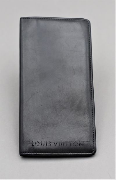 null Louis VUITTON. Black leather card holder. 

Twelve slots and four pockets for...
