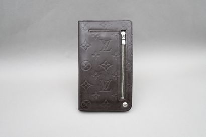 null 
Louis VUITTON. Black patent monogram canvas checkbook. One zipped pocket for...