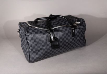 null 
Louis VUITTON. Travel bag in graphite checkerboard canvas. With shoulder strap.

Height:...
