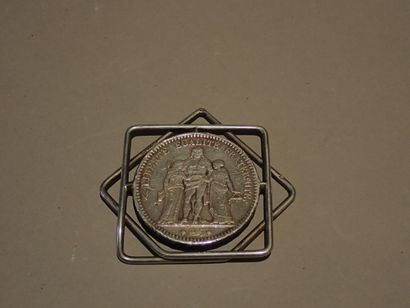  HERMES. Money clip decorated with a 5 francs...