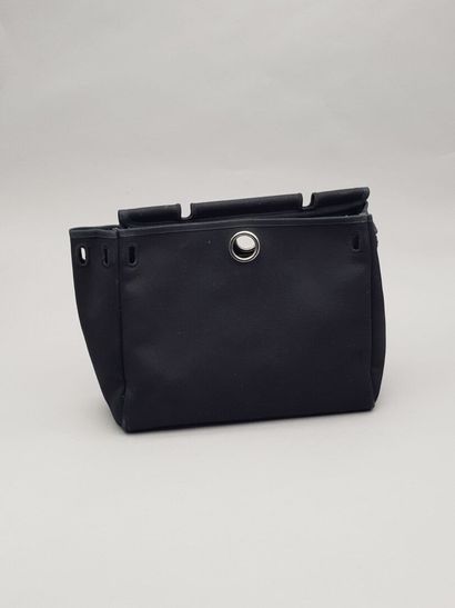 null 
HERMÈS, Paris

Handbag, "Herbag" model, in black leather and grey coated canvas....
