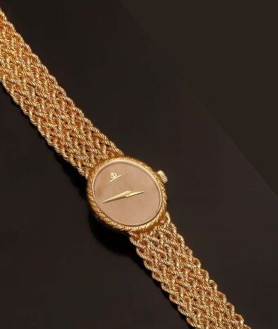 null BAUME ET MERCIER, Geneva. 

Lady's watch in 18K yellow gold (750 °/°°). Oval...