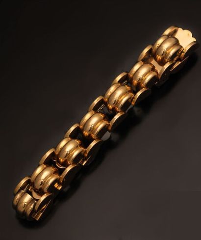 null Yellow gold bracelet 18K (750 °/°°) articulated and openwork, in the form of...
